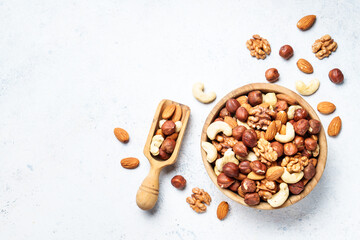 Nuts assortment at white background. Almond, hazelnut, cashew in wooden bowl. Top view - 783200594
