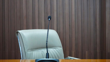 selective focus table microphone with white chair in the meeting room for teleconference           ...