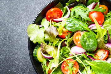 Healthy food. Green Salad with fresh leaves and vegetables. Close up. - 783203119