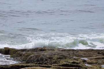 Ocean waves splashing on a rocky shore