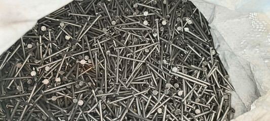 close up of a pile of steel nails background