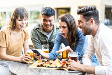 Spontaneous moments of friendship revealed. A diverse group of friends shares laughter and surprises over drinks and snacks, embodying the spirit of millennial connection.