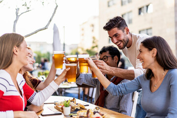 Cheers to good times and great company. A multiethnic group of friends celebrate together, embodying the joy of millennial gatherings. Lifestyle concept