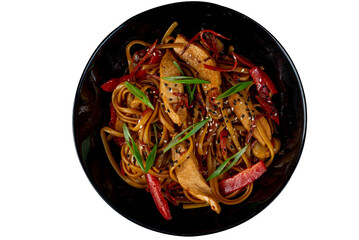 Asian wok noodles with chicken and vegetables with chopsticks on the table. - 783219939