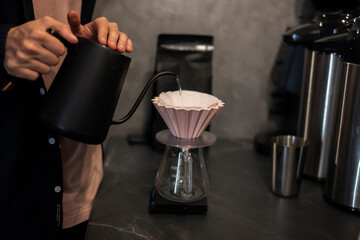Precision Pour-Over Coffee Brewing With Black Kettle and Paper Filter Funnel