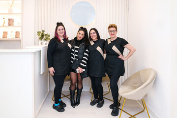 Hair clinic staff with a stylish client in modern setting.