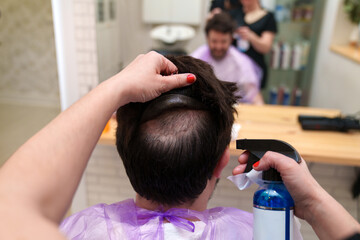 A stylist ensures hairpiece hygiene with expert cleaning