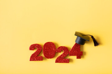 Red number 2024 with graduated cap. Class of 2024 concept.