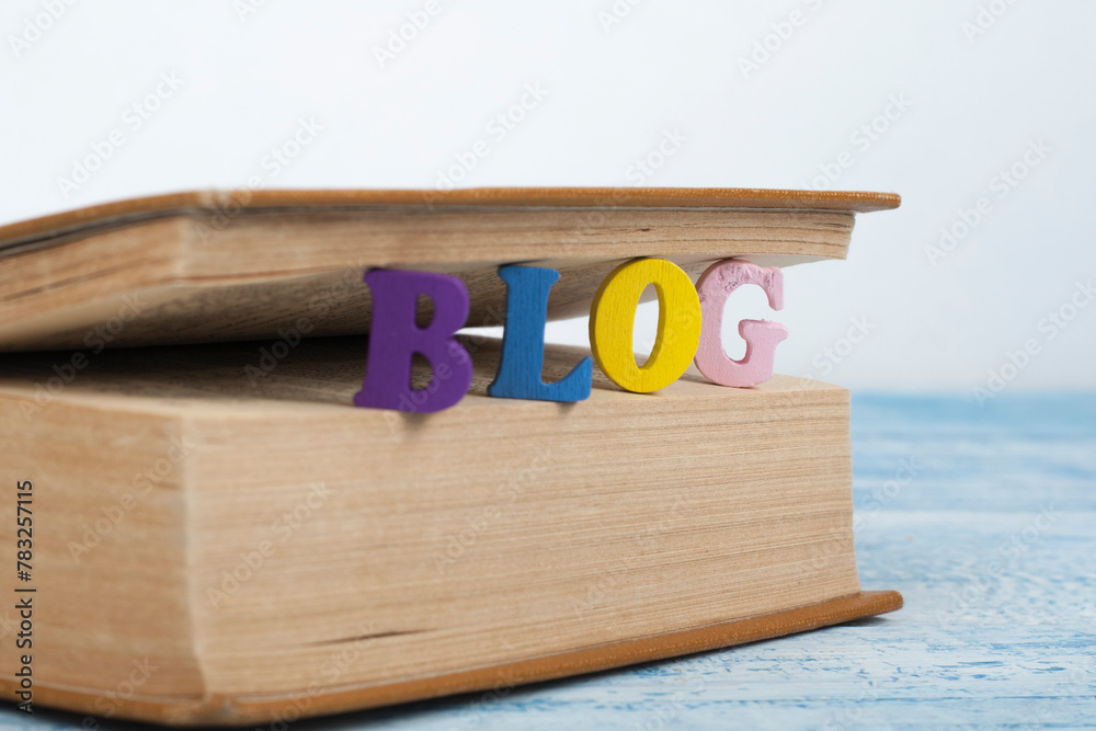Fototapete blog word on wooden background composed from colorful abc alphabet block wooden letters, copy space 
