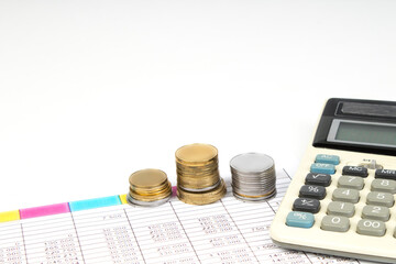 Financial Charts, graphs, coins, calculator on isolated white background.