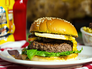 Bitten cheeseburger on a plate
