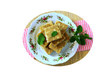 popular indian gujarati traditional sweet sukhdi,in india state wise various name of this sweet as gol papdi,magas burfi,son papdi,offering to god at pray time,cutout in transparent background,png  © gv image