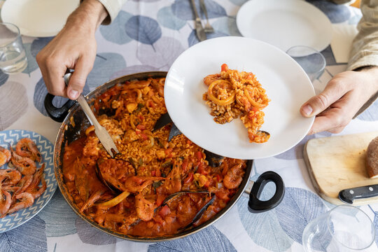Man serving paella 