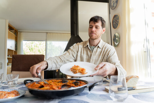 Man serving paella 