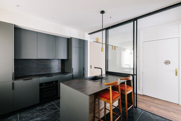 Modern and elegant kitchen with sliding glass doors