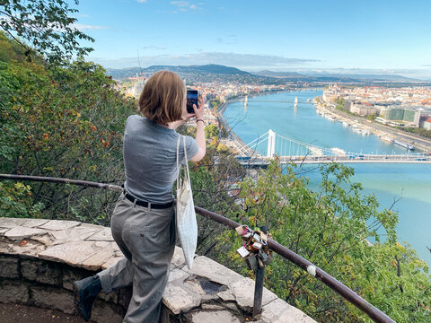 Girl taking picture of Budapest