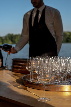 Anonymous bartender serving wine