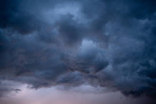Stormy sky clouds at sunset