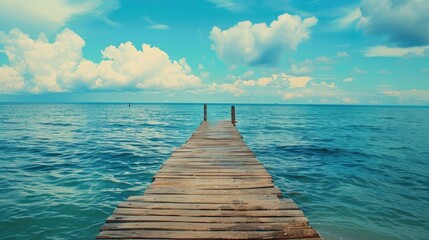 A scenic view of a wooden pier reaching out into the vast ocean. Perfect for travel and vacation...