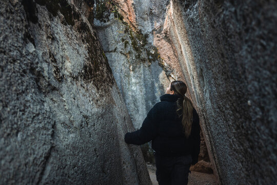 Woman between Stone Walls