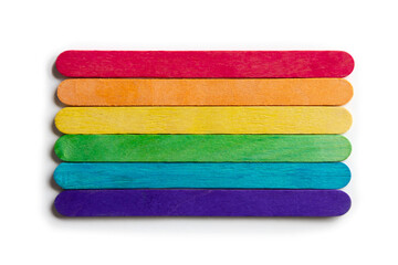 set of wooden sticks together, forming a multicolored rectangle, white background