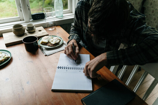 Man draws with coffee