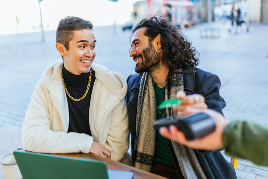 Happy gay couple enjoying time together outdoors