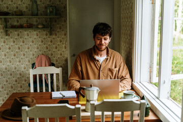 Man working with laptop at home