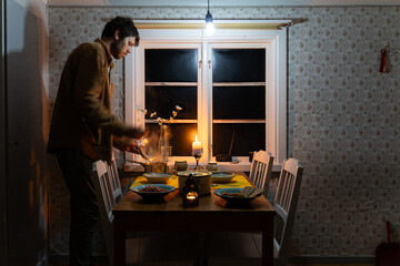 Man serves dinner at home