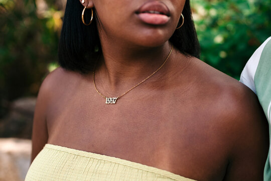 Anonymous woman with 1997 necklace