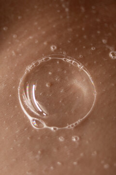 Shower Soap Bubble On Human Body Skin Part