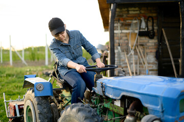 Woman Farmer Driving Vintage Blue Tractor at Sunset