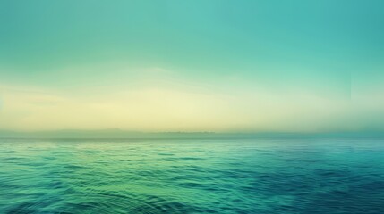 Fototapeta premium A gradient background transitioning smoothly from blue to green, creating a serene and tranquil ambiance