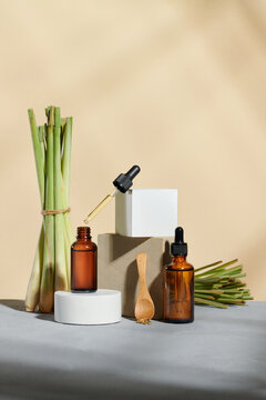 Bunches of lemongrass and glass bottles containing