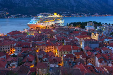 Top view of the old town in Kotor and a big cruise ship at night, Montenegro - 783288304