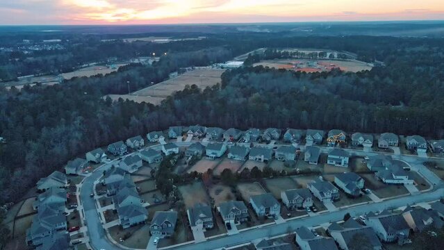 Aerial sunset landscape of forest and suburban neighborhood in Evans Augusta Georgia