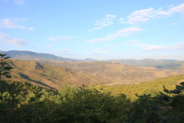 Naklejka premium landscape , mountains , trees and blue sky , nature