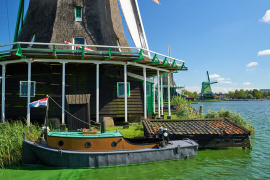 Archetypal Holland windmills & Dutch boat - tourism travel destination