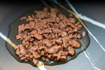 Food for animals background. wet cat and dog food texture, pattern. Pet meal background close up. wet food for pet dogs and cats. Dried pet food top view. Granules of good nutrition for dogs and cats.