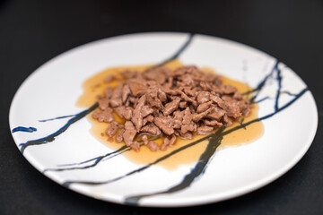 Food for animals background. wet cat and dog food texture, pattern. Pet meal background close up. wet food for pet dogs and cats. Dried pet food top view. Granules of good nutrition for dogs and cats.