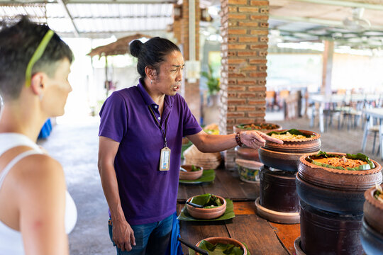 Man showing typical Thai food.