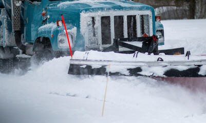 Close up of the plow of a snow plow clearing snow