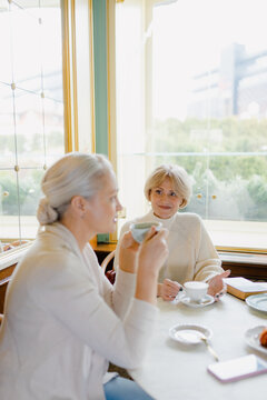 Meeting of two friends in a cafe