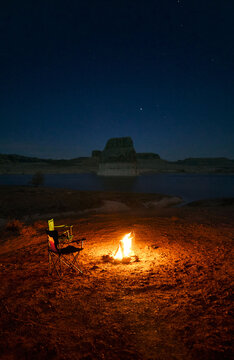 Firepit by a lake at night
