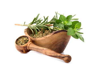 Oregano or marjoram leaves isolated on white background. Oregano with rosemary. Spices in woodem bowl.