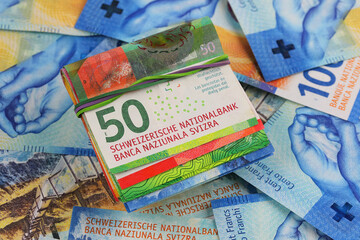 Banknotes folded in half and others, CHF, Swiss currency