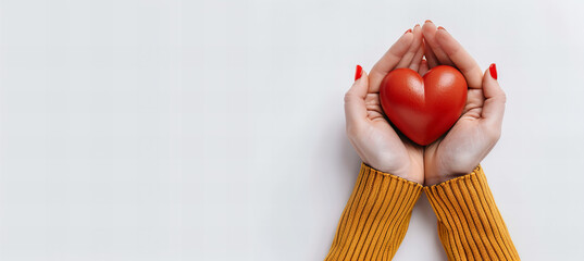 Woman hands holding red heart supporting blood donation to save life concept, isolated on white background.
