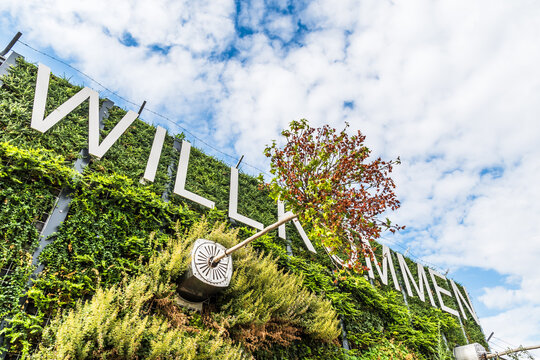 Vertical plants with word Willkommen (translation: welcome), entrance into a park