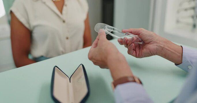 Hands, lens or glasses in optician, business or retail as expert, repair or maintenance in store. Frame, optometrist or customer at counter as advice, crm or eyewear to show damage on product return