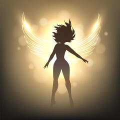 Beauty Woman with Angel Wings on Blurry Glowing Golden Background